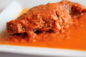 Zdjęcie - Duszony królik w sosie pomidorowym - Przepisy kulinarne ze zdjęciami